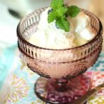 homemade whipped cream in a purple glass bowl
