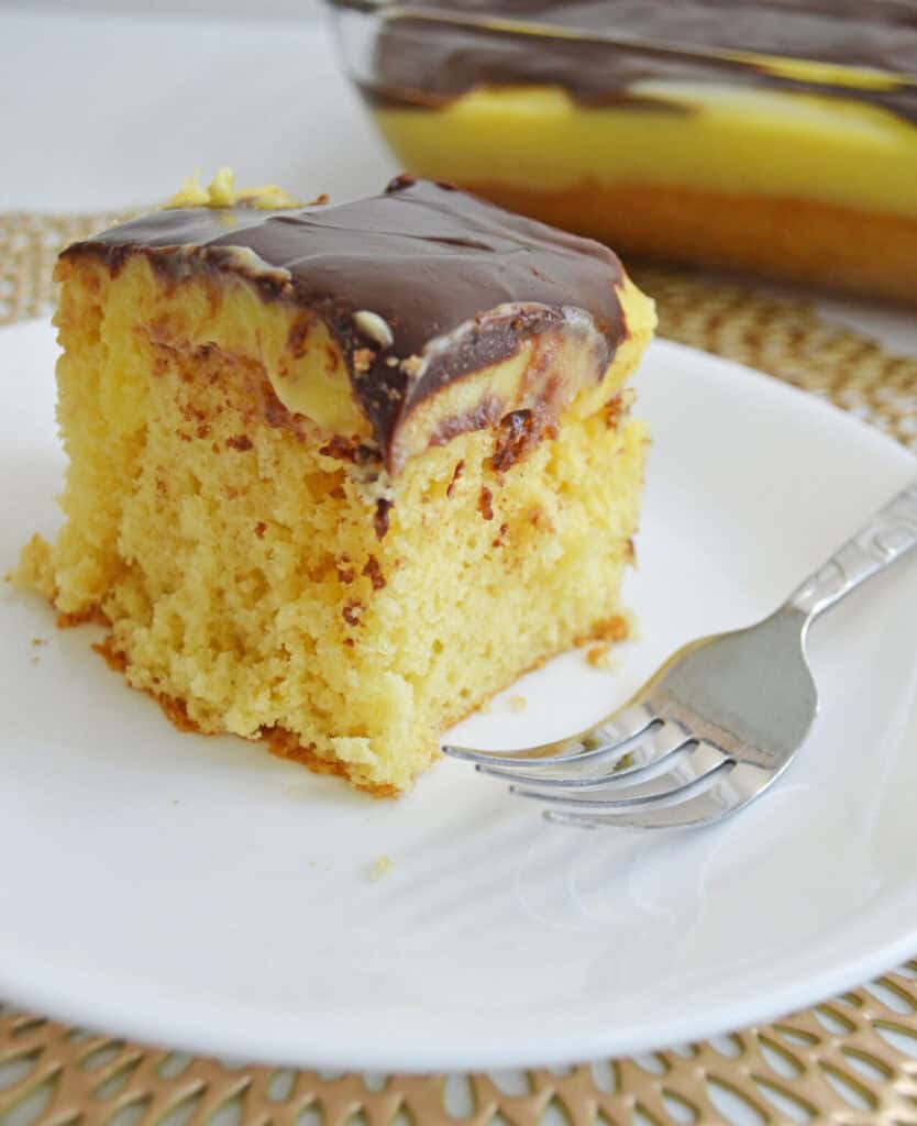 Slice out of Boston Cream Poke Cake