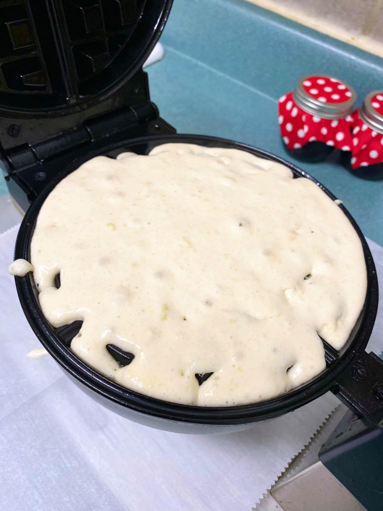 waffle iron covered in waffle batter
