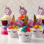Unicorn cupcakes with rainbow frosting and white tile background.