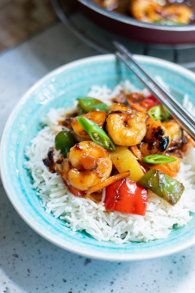 sweet and sour shrimp on blue plate