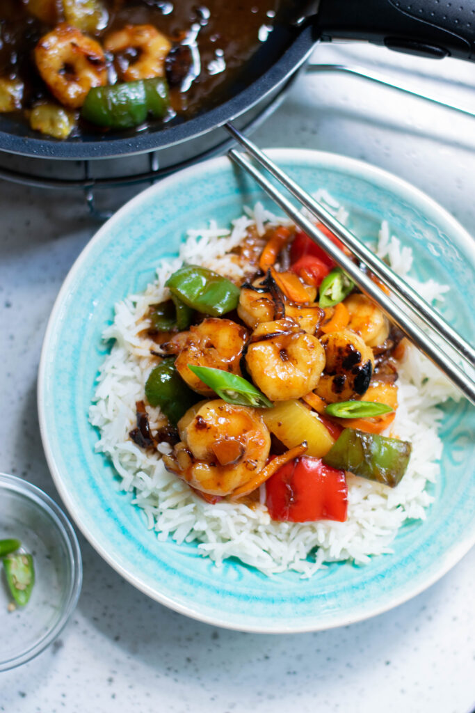 sweet and sour shrimp on blue plate