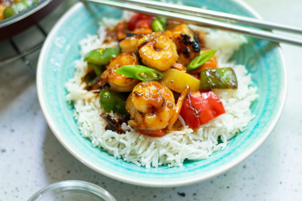 sweet and sour shrimp on blue plate