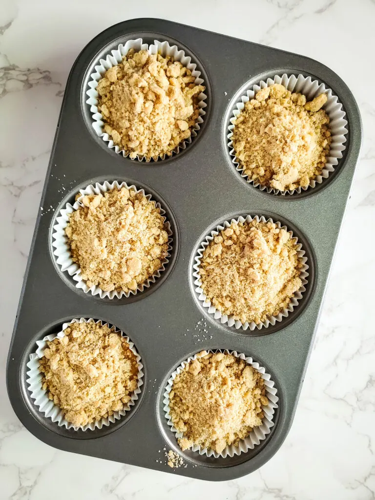 Sprinkle the crumble topping over your muffin batter before baking.