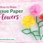 A group of colorful tissue paper flowers displays vibrant hues and intricate designs.