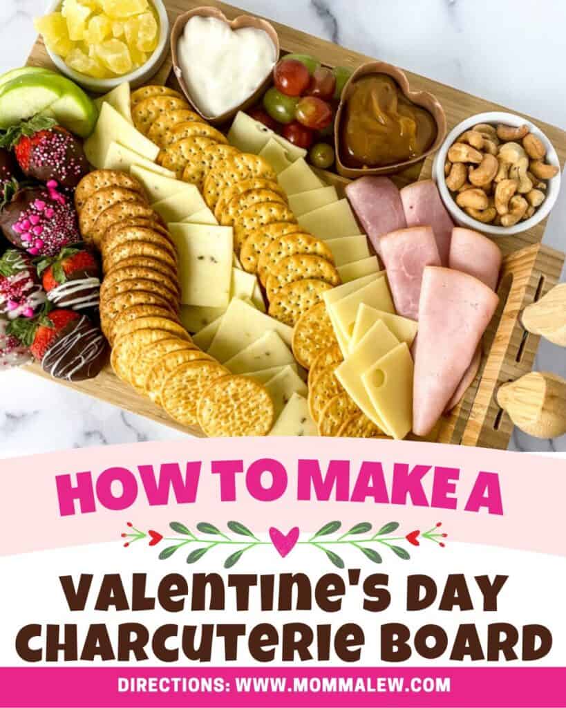 A Valentine’s Day Charcuterie Board with crackers, sliced cheeses, deli meats, strawberries, chocolate-covered treats, grapes, heart-shaped dip, pickles, and nuts. Text reads How to Make a Valentines Day Charcuterie Board.