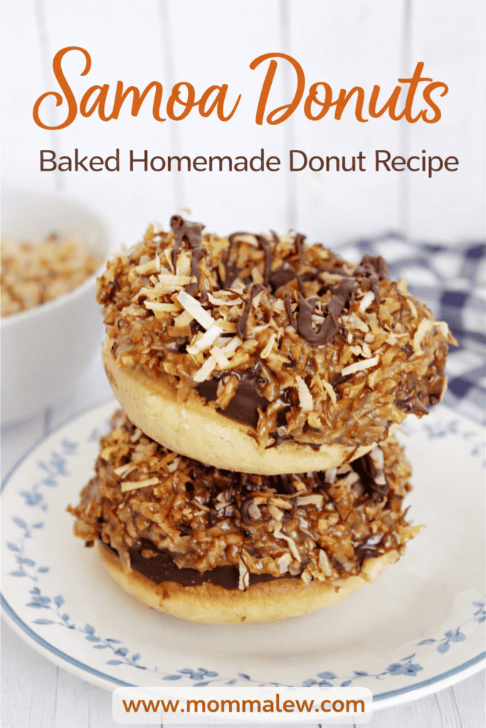 Two samoa donuts topped with toasted coconut, caramel, and chocolate drizzle are stacked on a floral plate. Text above reads Samoa Donuts: Baked Homemade Donut Recipe, with www.mommalew.com at the bottom.