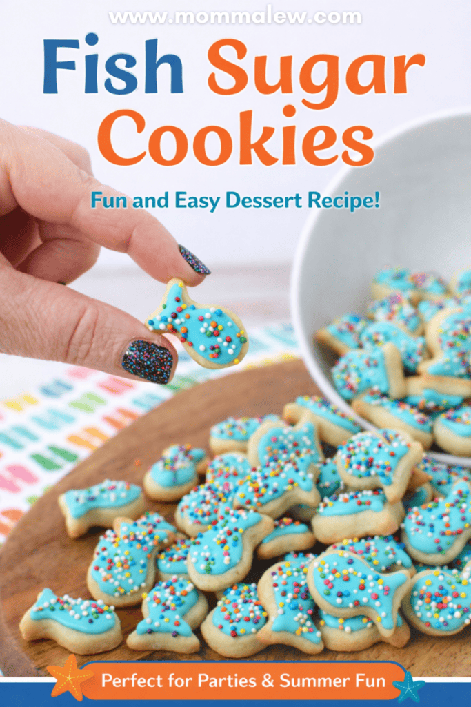 A hand holds a small, fish sugar cookie decorated with blue icing and colorful sprinkles over a bowl filled with similar treats. Text reads “Fish Sugar Cookies—Fun and Easy Dessert Recipe!”.
