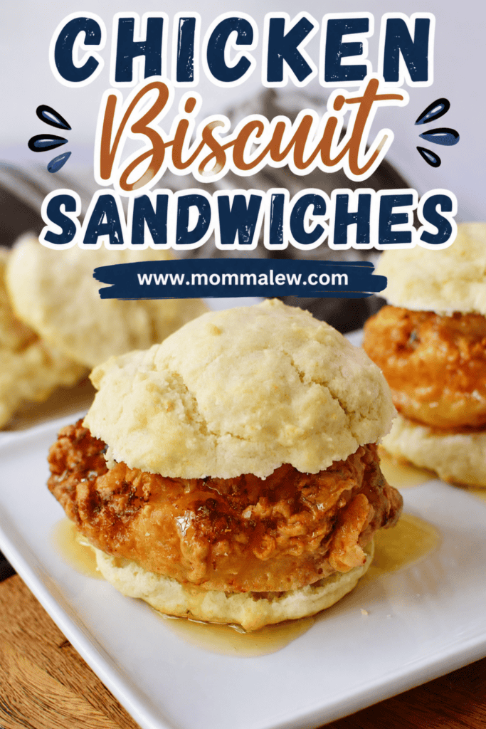A close-up of crispy chicken biscuit sandwiches drizzled with honey on a white plate. The text above reads Chicken Biscuit Sandwich Recipe with a website URL, www.mommalew.com.