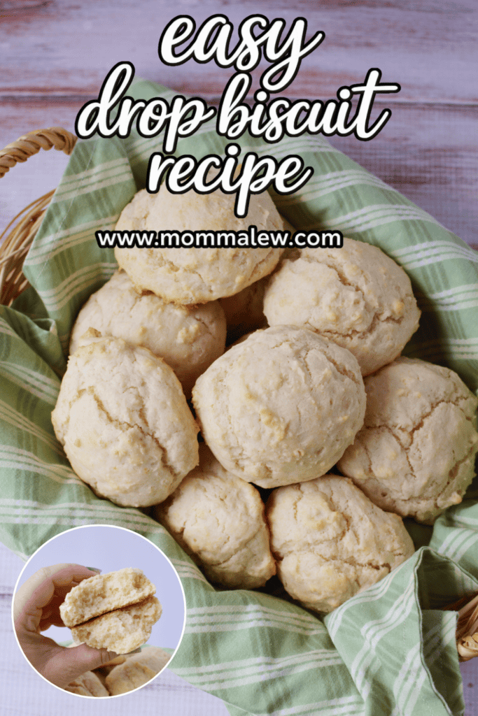 A basket lined with green plaid cloth holds several fluffy biscuits. Text reads Drop Biscuit Recipe and www.mommaleew.com. An inset shows a hand holding a split biscuit.
