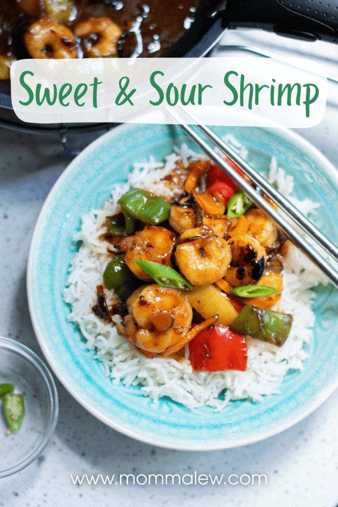 A bowl of white rice topped with sweet and sour shrimp, bell peppers, and pineapple is served with chopsticks. The colorful dish features saucy sweet and sour shrimp. Text reads Sweet & Sour Shrimp and www.mommalew.com.
