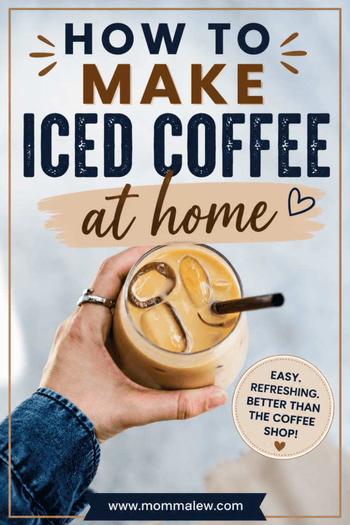 A hand holding a glass of iced coffee with a metal straw. Text on the image reads: How to make iced coffee at home—easy, refreshing, and better than the coffee shop! Learn how to make iced coffee at home at www.mommaleew.com.