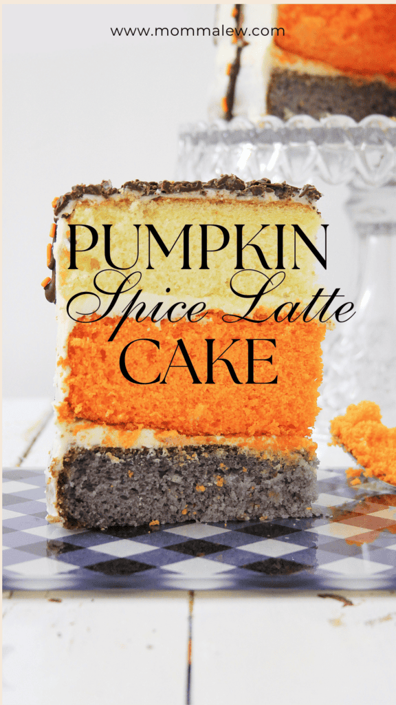 A slice of pumpkin spice latte cake with orange, cream, and dark brown layers sits on a checkered plate. The text “Pumpkin Spice Latte Cake” is written over the cake, perfectly capturing the cozy flavors of fall. The website mommalew.com appears at the top.